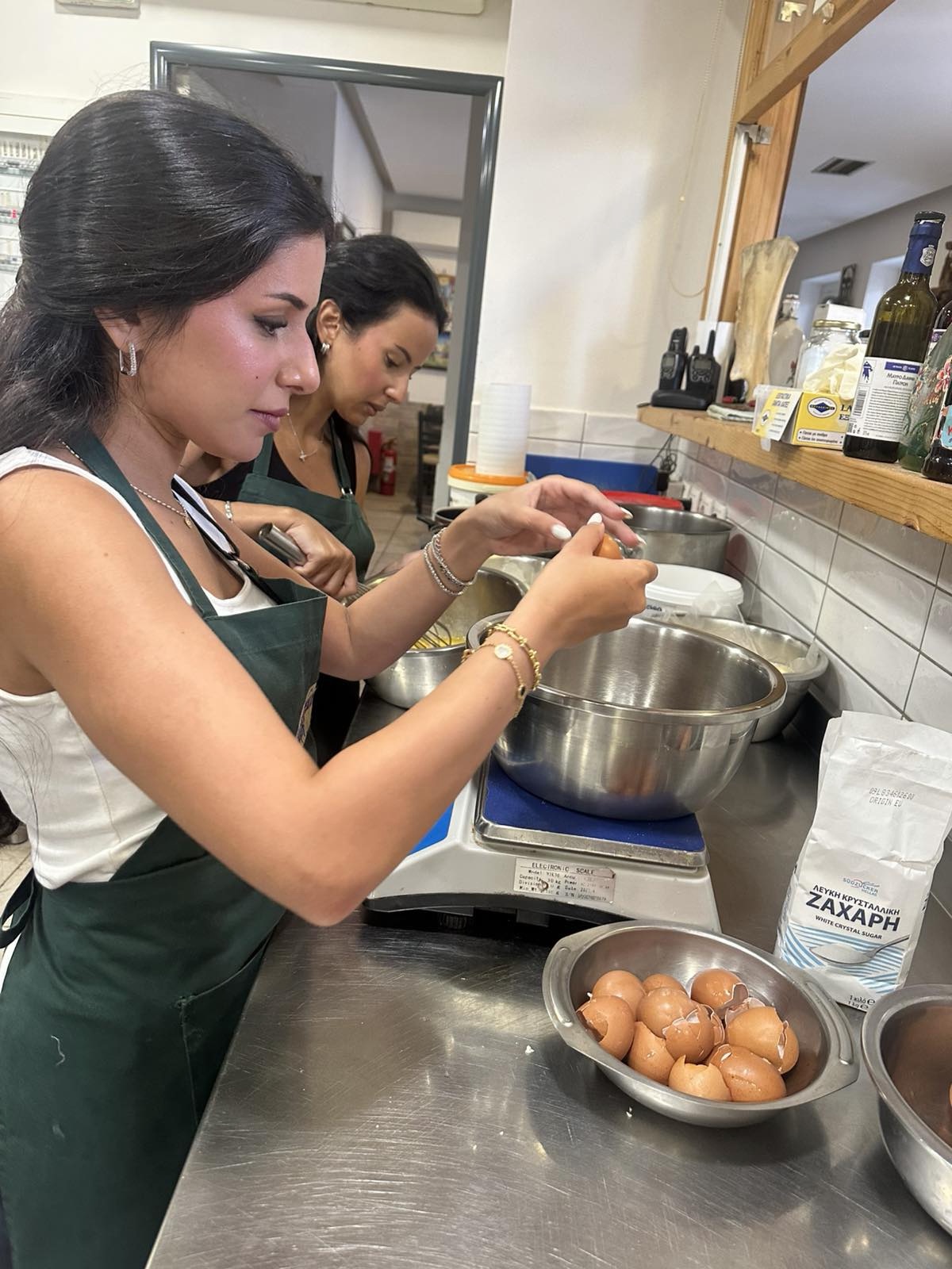 Cracking eggs for the orange pie mixture